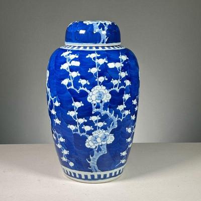 CHINESE BLUE & WHITE GINGER JAR | Lidded jar decorated in a white floral pattern on a deep blue ground, with six character mark in...