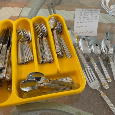 Wallace Chardonnay pattern  gold trim   Set of 12 less a couple forks 
MAKE OFFER