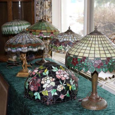 part of the collection of antique and 20th century stain glass lamps. over 15 lamps of various sizes to include large ceiling hanging...