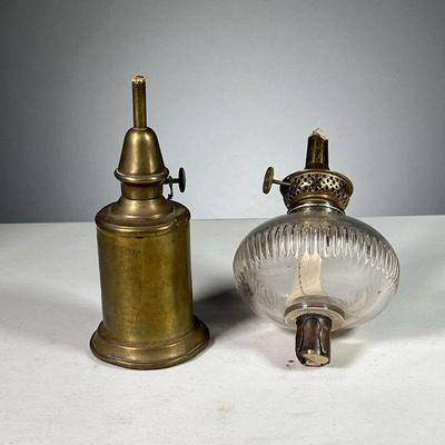 (2PC) OIL LAMPS | Including a brass oil lamp with engraving â€œLampe Pigeonâ€ and a lass oil lamp with glass chimney