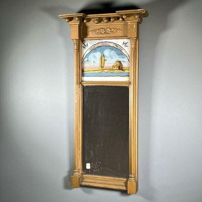 ANTIQUE REVERSE PAINTED MIRROR | Featuring painted glass frame with gilt farmhouse and wreath relief on top