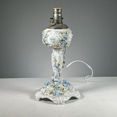 HAND PAINTED FLORAL LAMP | Fancy porcelain table lamp, having hand painted applied flowers with gilt accents, with underglaze blue mark...