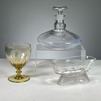 (3PC) GLASS DECANTER & BOWL | Includes circular glass decanter with top, oval shaped cut glass bowl with lion relief on bottom & yellow...