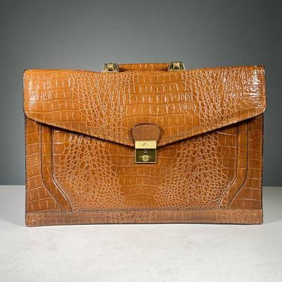 ALLIGATOR LEATHER BAG | Genuine alligator leather bag with felt liner, Amiet lock, and polished hardware Dimensions: w. 16.5 x h. 11 in.