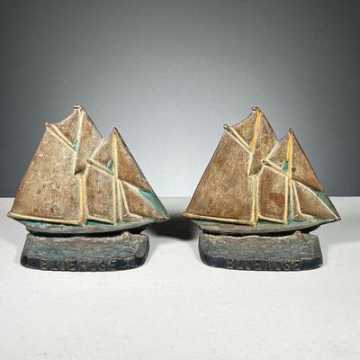 (2PC) IRON SAILBOAT BOOKENDS | Cast iron painted sailboats titled â€œBluenoseâ€ stamped Canada on back.