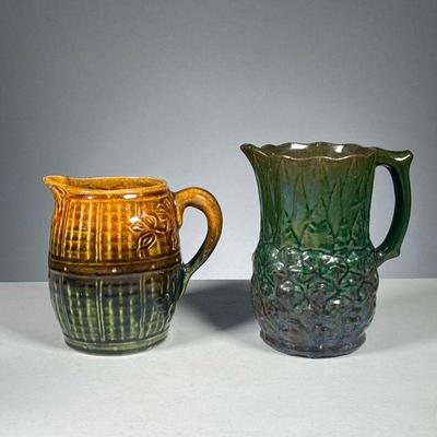 (2PC) POTTERY PITCHERS | Two open pitchers with relief patterns