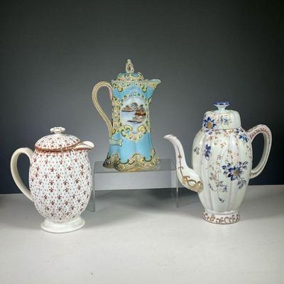 (3PC) PORCELAIN COFFEE POTS | Including an intricately decorated Japanese coffee pot with hand painted coastal town in reserve on a blue...