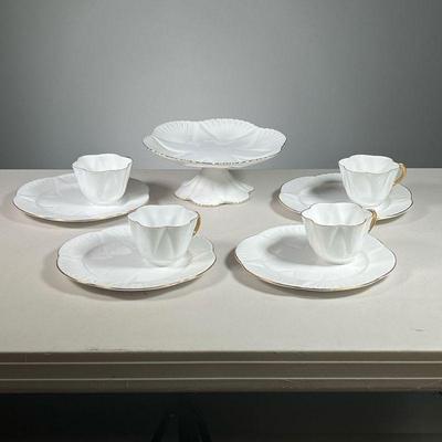 (9PC) SHELLEY ENGLISH CHINA | Includes: Compote with gilt rim, 4 small plates with indent for teacup & 4 teacups all with gilt rims....