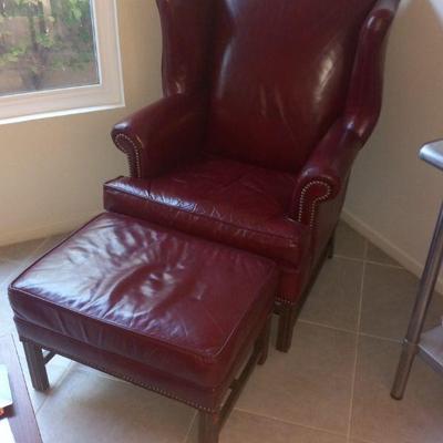 Great Red leather wing chair and foot stool