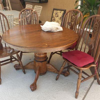 Round oak table with chairs  would look great painted 