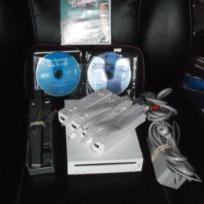 Nintendo Wii with 4 controllers, audio bar and games