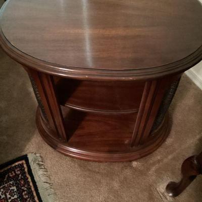 vintage oval side table with metal sides
24 in. wide
18 1/4 in. deep
22 3/4 tall
($50.00)