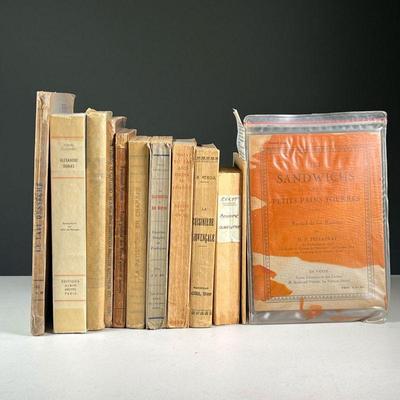 (12PC) FRENCH COOKBOOKS | Early to mid-20th century softcover bindings, some with glassine covers, including: Les Meilleures Recettes...