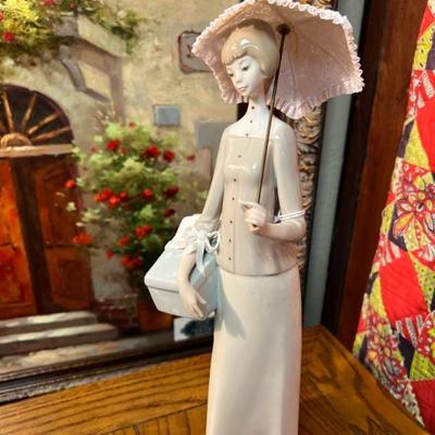 Delicate French lady with parasol.