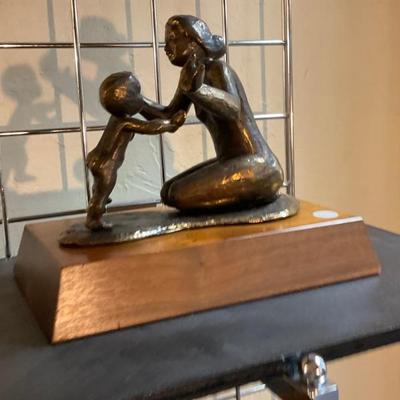 Mother embracing child bronze 