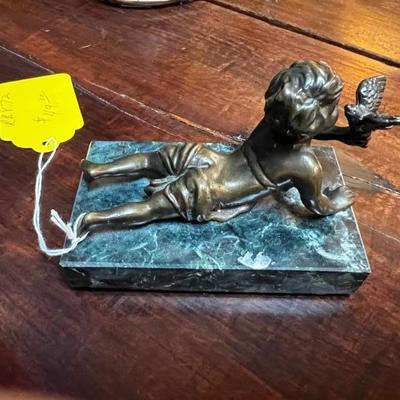 Bronze boy with bird.