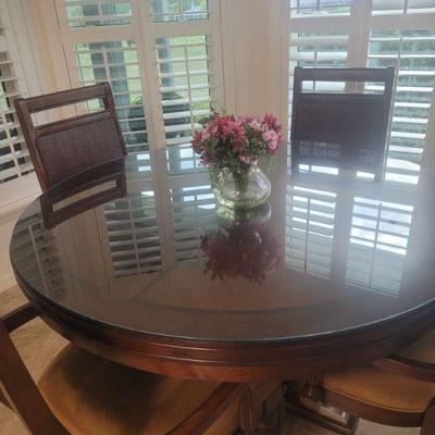 Round, wooden dining or nook table and four chairs, set