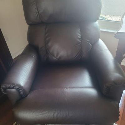 There about five of these leather chairs