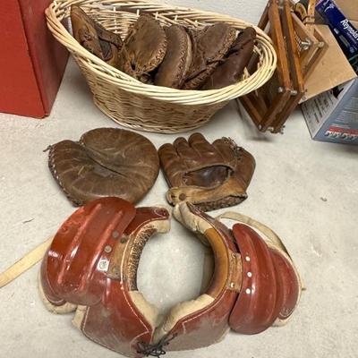 Vintage baseball gloves, vintage football pads