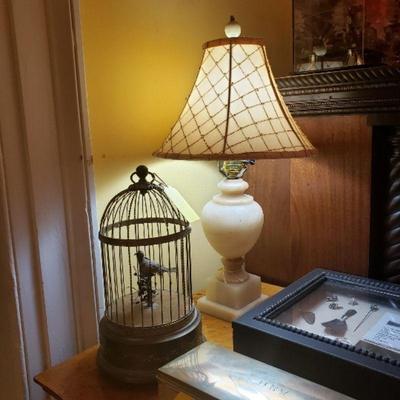 Antique singing automaton bird in a cage