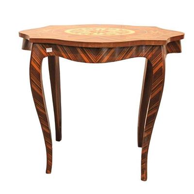 
Lot 402
French style turtle top inlaid lamp table in the exotic woods
