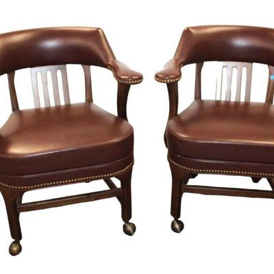 
Lot 369
Pair of leather style industrial tacked arm chairs on rollers
