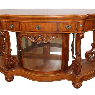 
Lot 351
Pulaski mahogany finish 3 drawer 1 door carved and fancy console/curio
