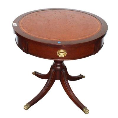 
Lot 221
Vintage mahogany base leather top drum table
