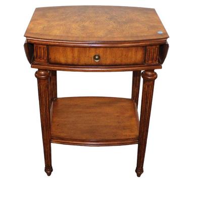 
Lot 341
Contemporary banded burl walnut finish 1 drawer drop side lamp table
