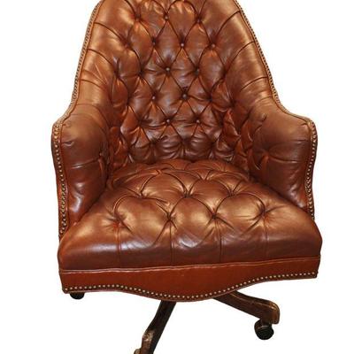 
Lot 325
Industrial tacked button tuft leather swivel lounge/office chair
