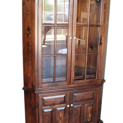 
Lot 217
Vintage Ethan Allen pine 12 pane corner cabinet
