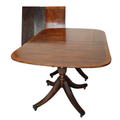 
Lot 405
Vintage banded mahogany dining room table with (3) 17.5" leaves attribute to Baker Furniture

