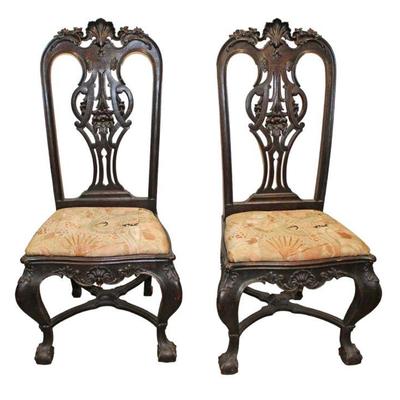 
Lot 170
Pair of antique highly carved high back solid mahogany arm chairs
