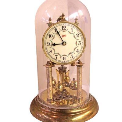 
Lot 269
Brass Ashatz wedding clock with key under dome
