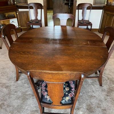 Tiger Oak 54" Round table w/5 11" leaves 54" W x 99"L
plus 8 oak & upholstered chairs $480