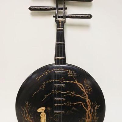 1231	BLACK LACQUERED ASIAN WALL HANGING IN THE FORM OF A BANJO, APPROXIMATELY 12 IN X 24 IN
