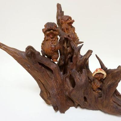 1133	FOLK ART WOOD CARVED HOBBIT LIKE FIGURES IN TREE, APPROXIMATELY 15 IN HIGH

