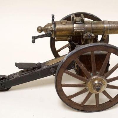 1135	SCALE MODEL OF A GATLING GUN HARTFORD CONN W/MECHANICAL ACTION, APPROXIMATELY 15 IN LONG X 8 IN HIGH
