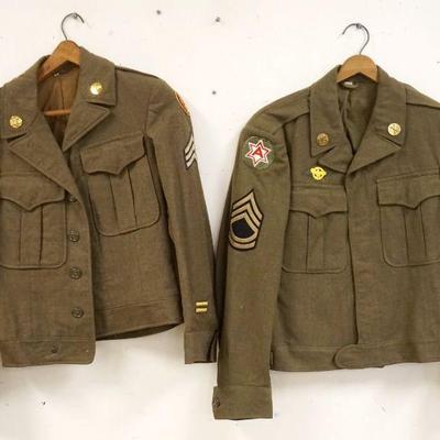 1174	2 US ARMY IKE FIELD JACKETS BOTH HAVE PINS & PATCHES, SIZE 34R & 36R, ONE HAS SMALL PIN HOLES IN THE BACK
