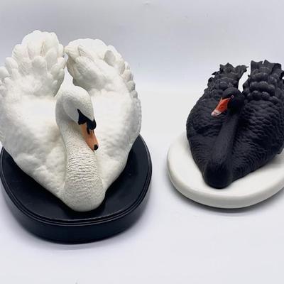 Black and white porcelain swans by Ronald Van Ruyckevelt