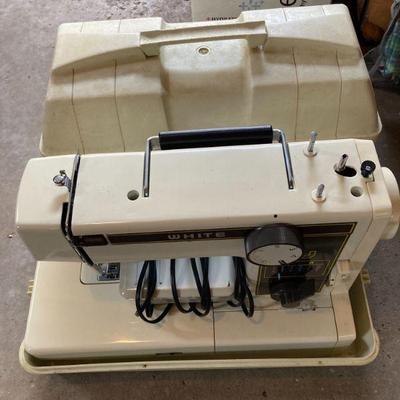 White sewing machine in case