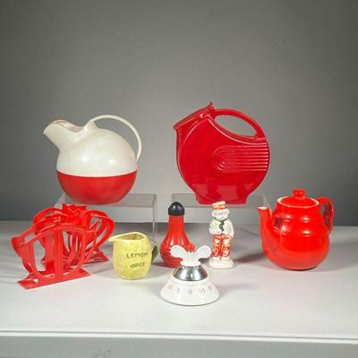 (9PC) MISC. KITCHENWARE | Vintage kitchen items and decor, including a red ceramic teapot, lemon juice pourer in the shape of a lemon,...