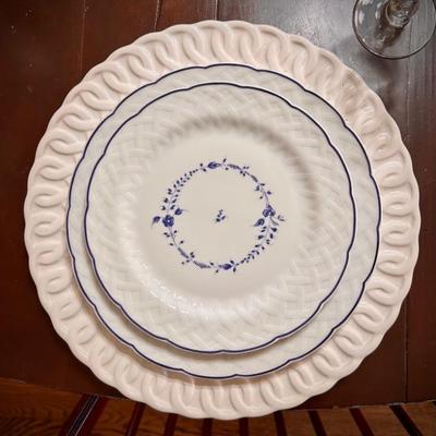 Set of 12 Limoges “Hortense” blue and white dinner plates and 12 luncheon plates. Also shown with set of white chargers.