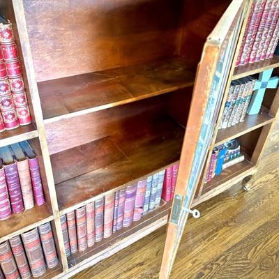 Antique bookcase with cupboard - cupboard door has inlaid map of 1600s USA