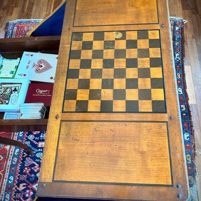 Antique game table with swivel game board.