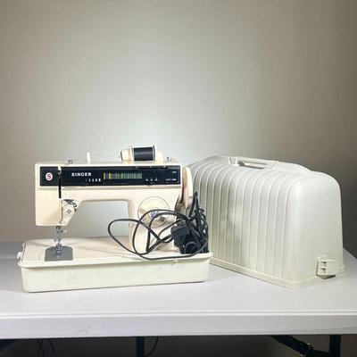 SINGER MODEL 1280 SEWING MACHINE | Appears in very good condition, with cover.
