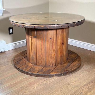 RUSTIC SPOOL TABLE | Wooden spool form table with a custom glass top. - h. 26 x dia. 40 in
