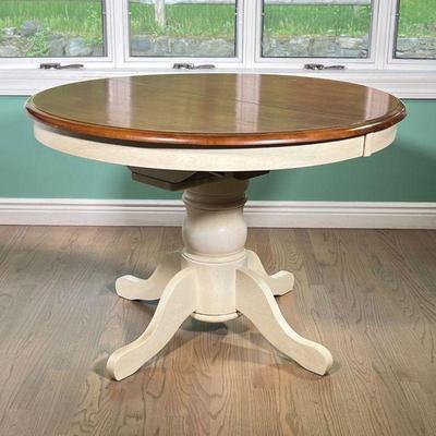 KITCHENETTE DINING TABLE | A small round white painted pedestal kitchen, or eat-in kitchen, table- with extension and one leaf inside...