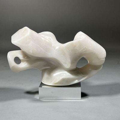 CONTEMPORARY CARVED STONE SCULPTURE | White onyx or alabaster carved as an amorphous organic figure, no apparent signature, on a metallic...