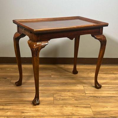 QUEEN ANNE STYLE END TABLE | Contemporary, having a galleried top over cabriole legs with shell knees, two slide out writing surfaces on...